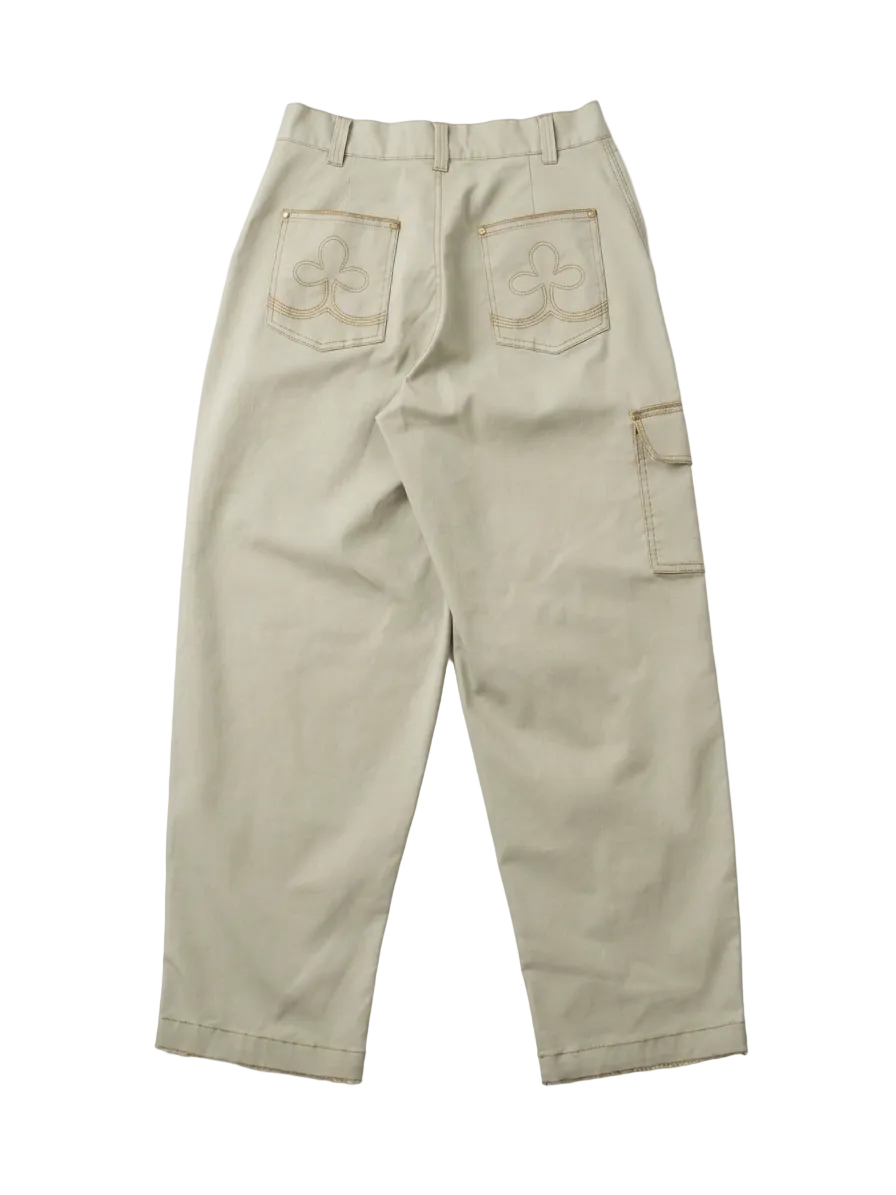 A pair of light beige cargo pants shown from the back, featuring two back pockets with embroidered clover-like logos and a side cargo pocket, laid flat on a white background.