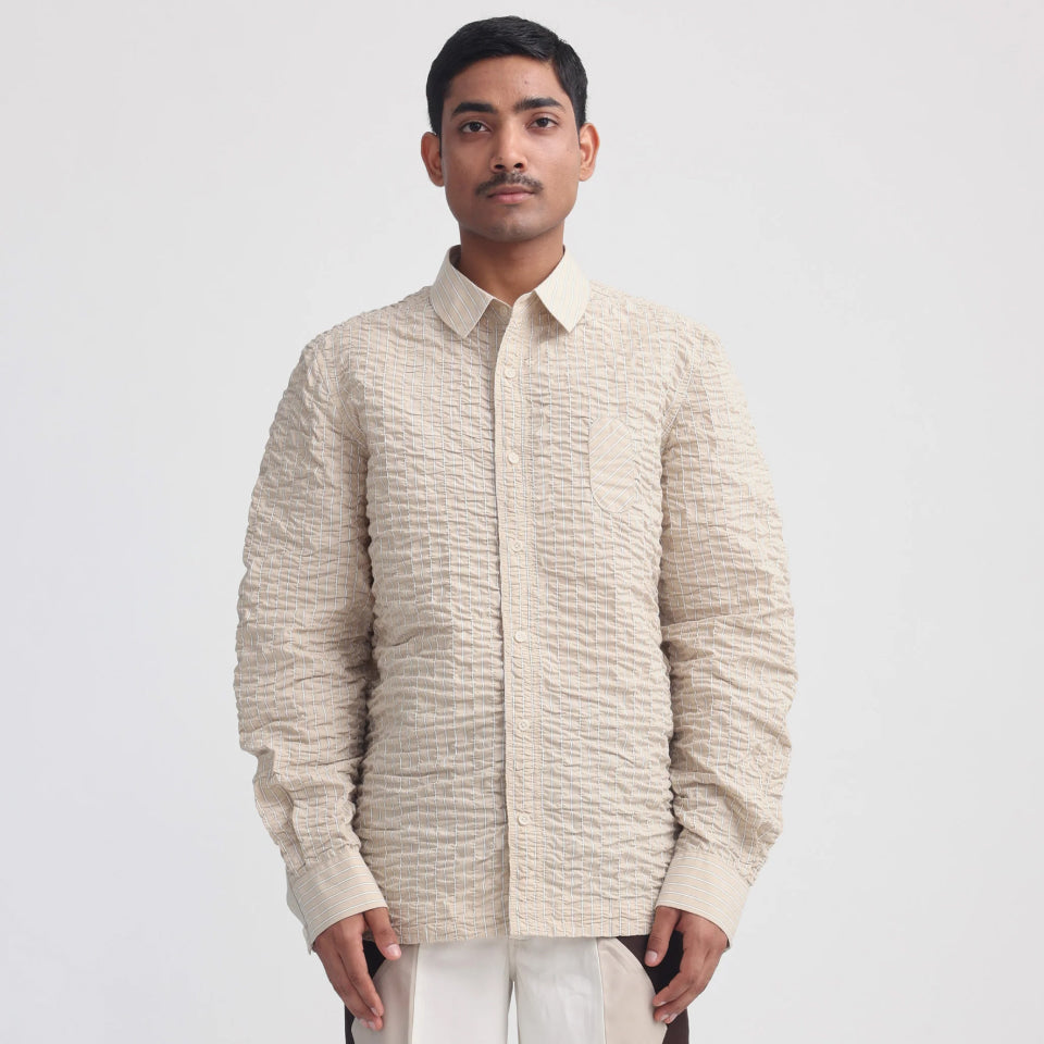 Model wearing the Projekt Street Actin Wrinkled Stripe Shirt - Beige, showcasing the relaxed fit.
