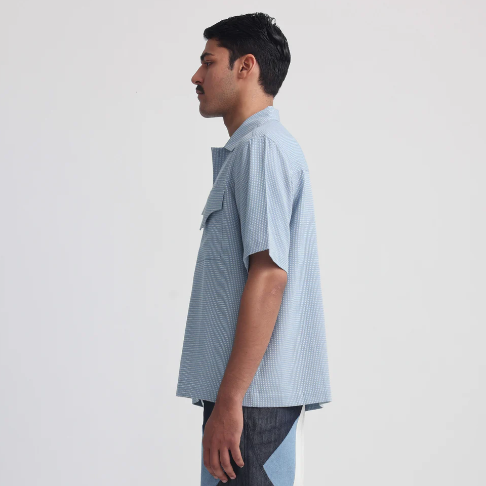 Flat lay of the Projekt Street Actin Blue Shirt, highlighting the handwoven fabric and unique details.