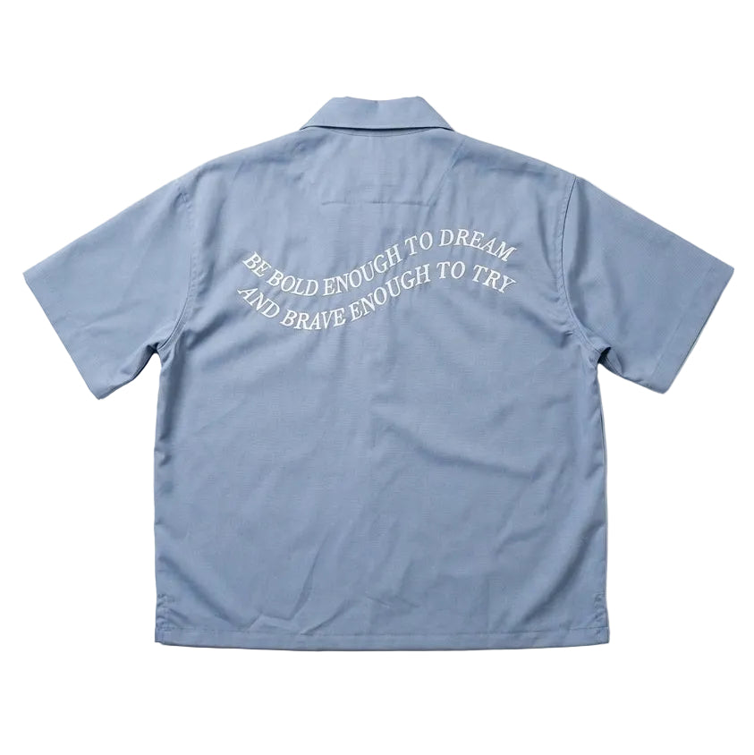 Light blue shirt with text on the back against a white background