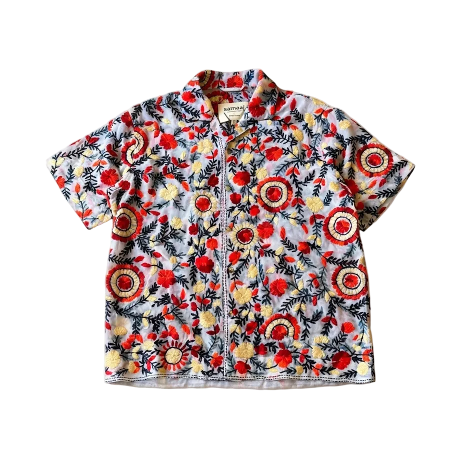 Short-sleeve shirt with colorful floral pattern on a white background