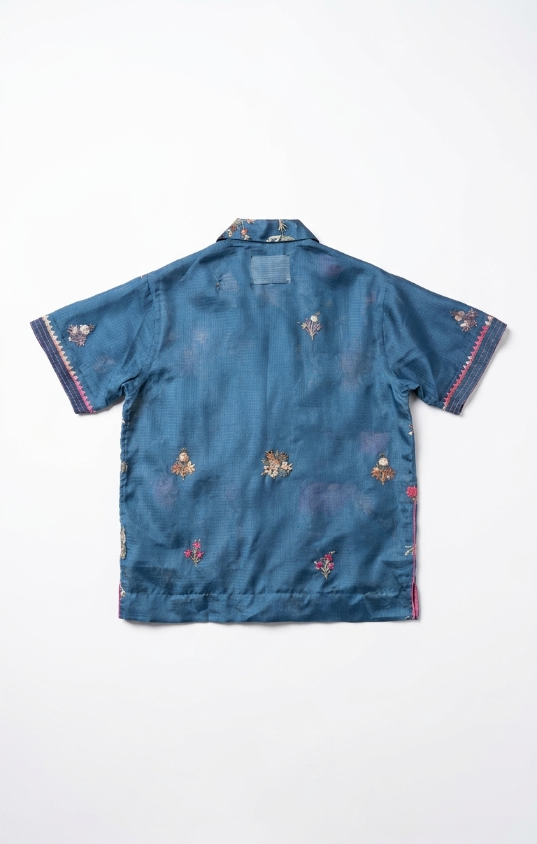 Blue shirt with floral patterns on a white background