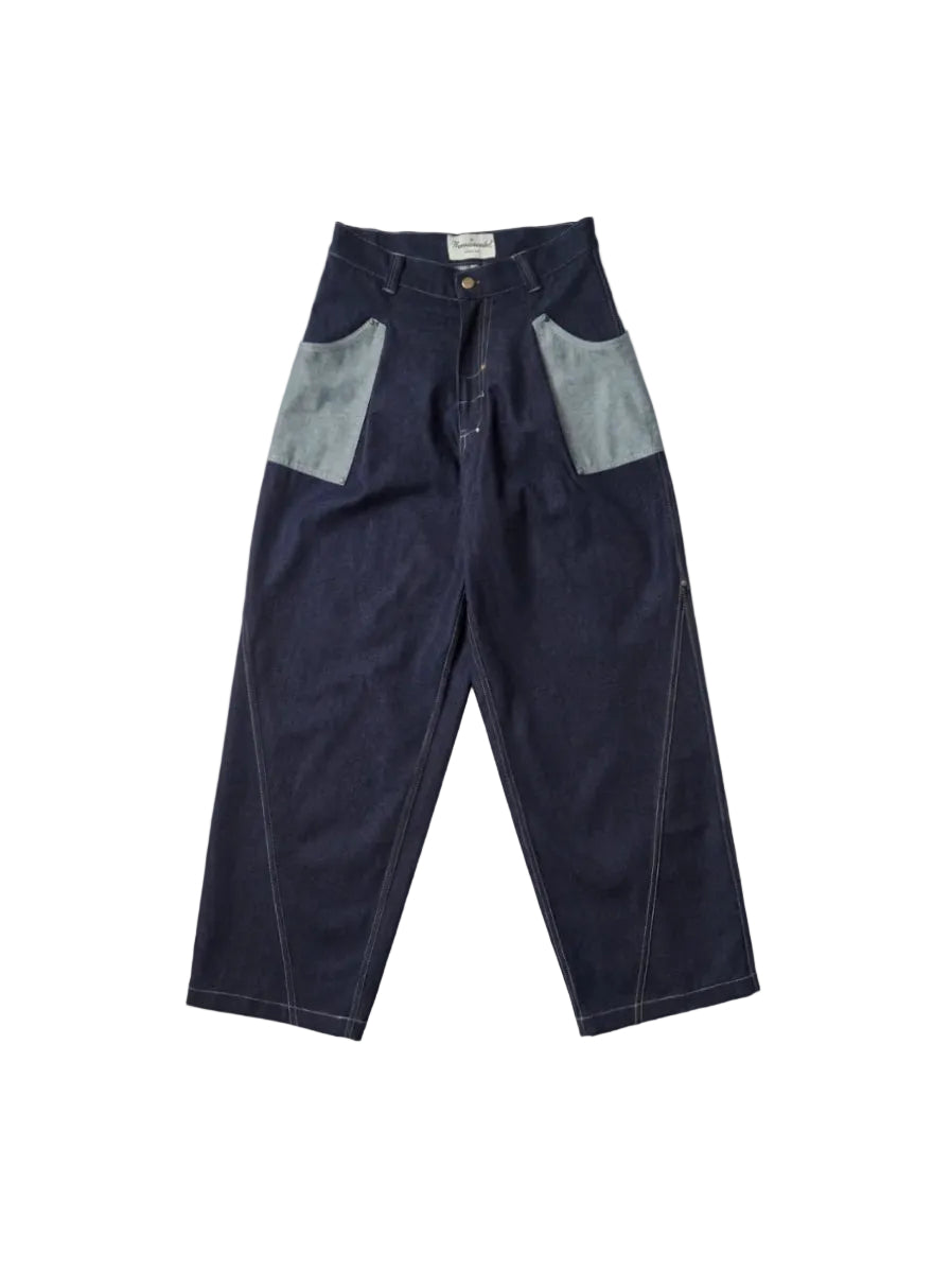 A pair of dark indigo denim work pants with contrasting light gray patch pockets and white contrast stitching, laid flat on a light gray background.