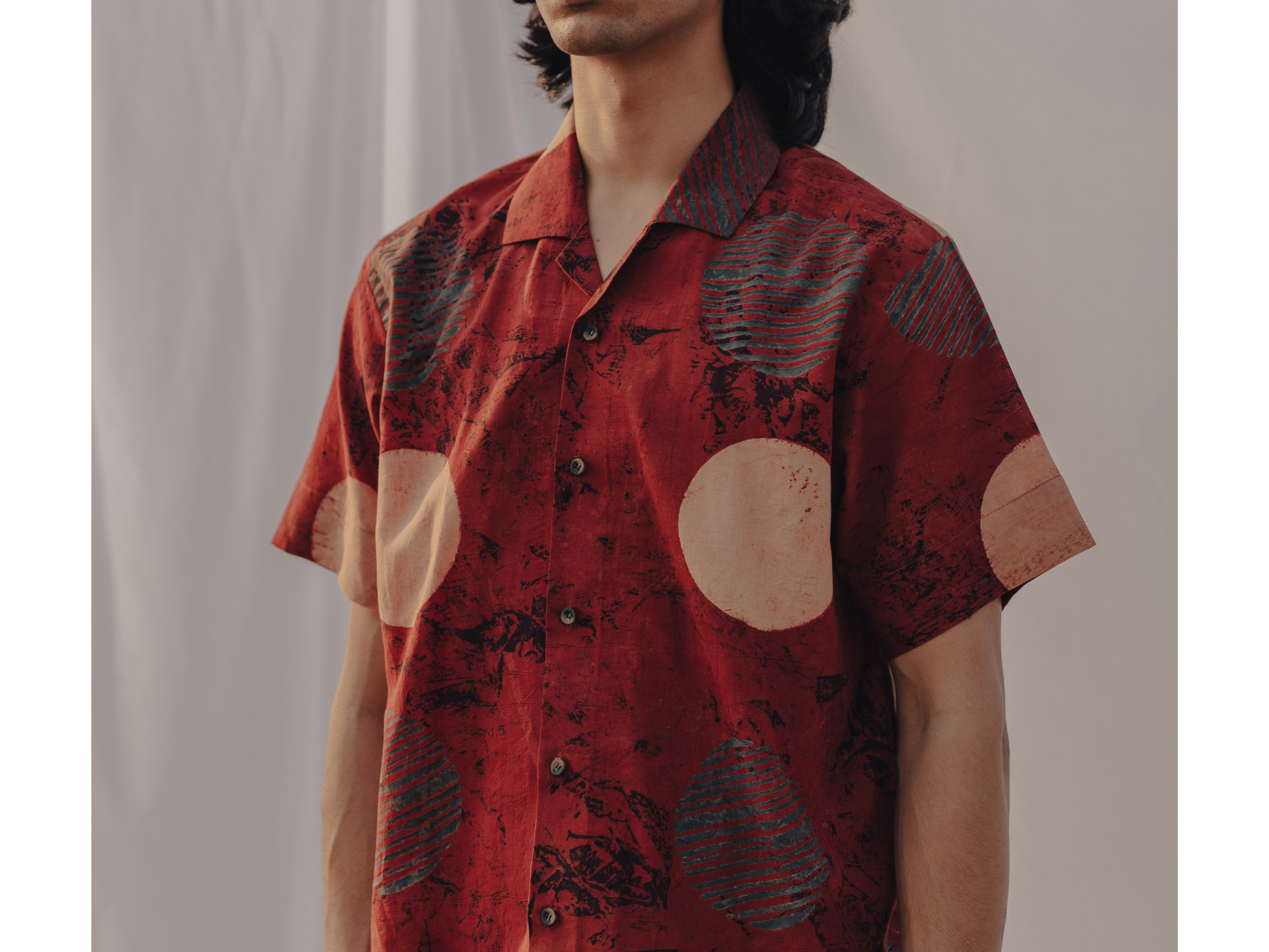 Horn buttons on Ajrakh Red Beige Circles shirt, adding a touch of tradition.
