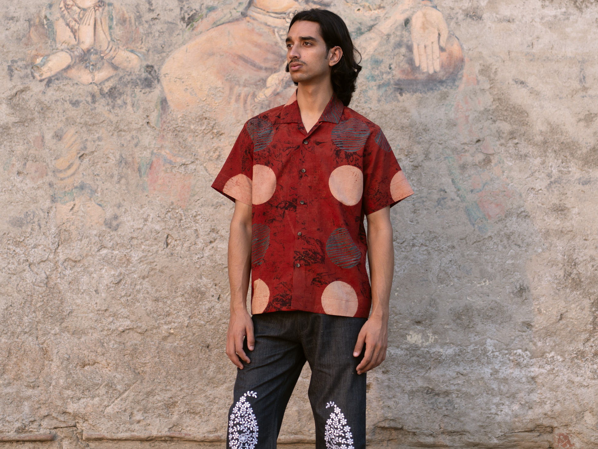 Natural dyes of pomegranate, jaggery, and turmeric on Ajrakh Red Beige Circles shirt.
