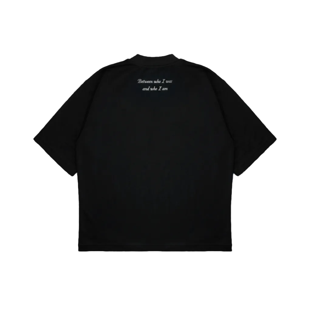 Black t-shirt with white text on the back against a white background